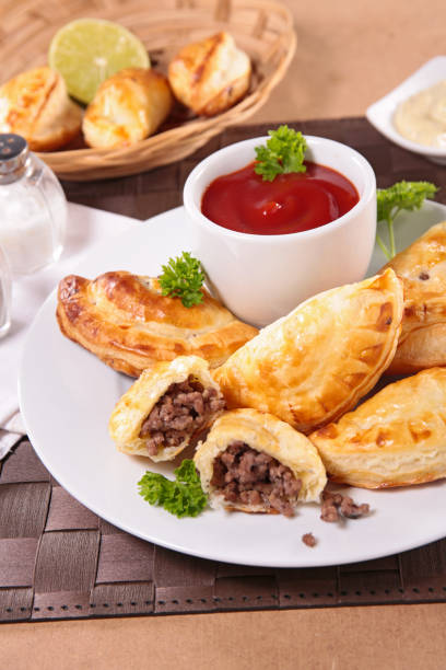 stuffed minced beef empanadas and tomato sauce