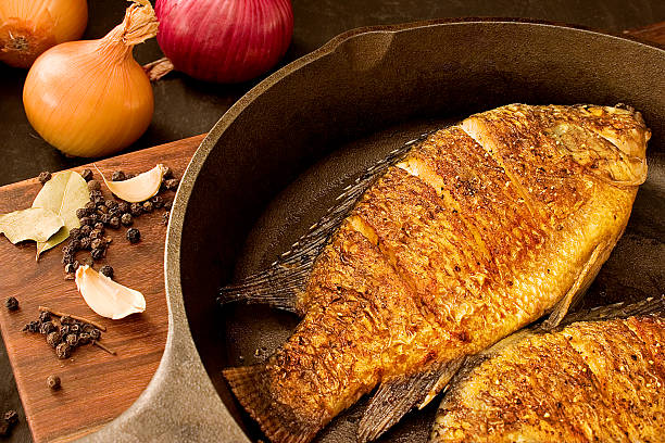 Fryied fish (whole tilapia) on a pan